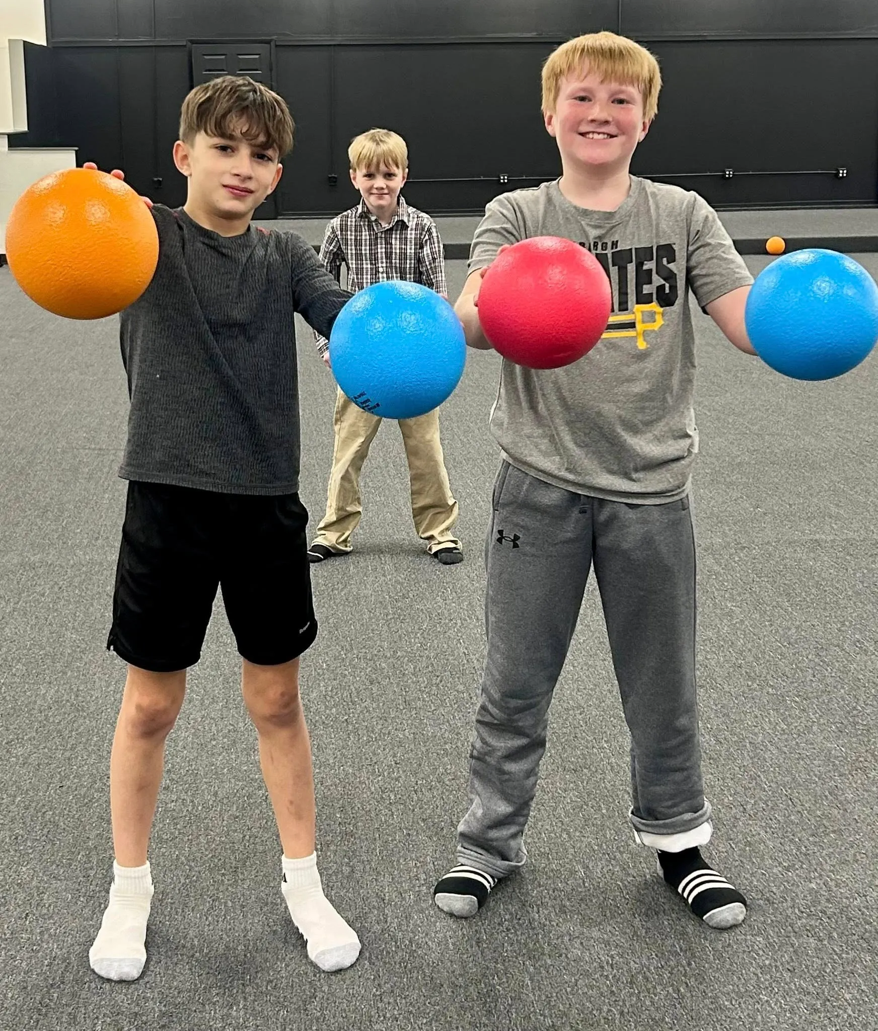 Young athletes holding training balls at Velocity Sports Lab in Steubenville, Ohio