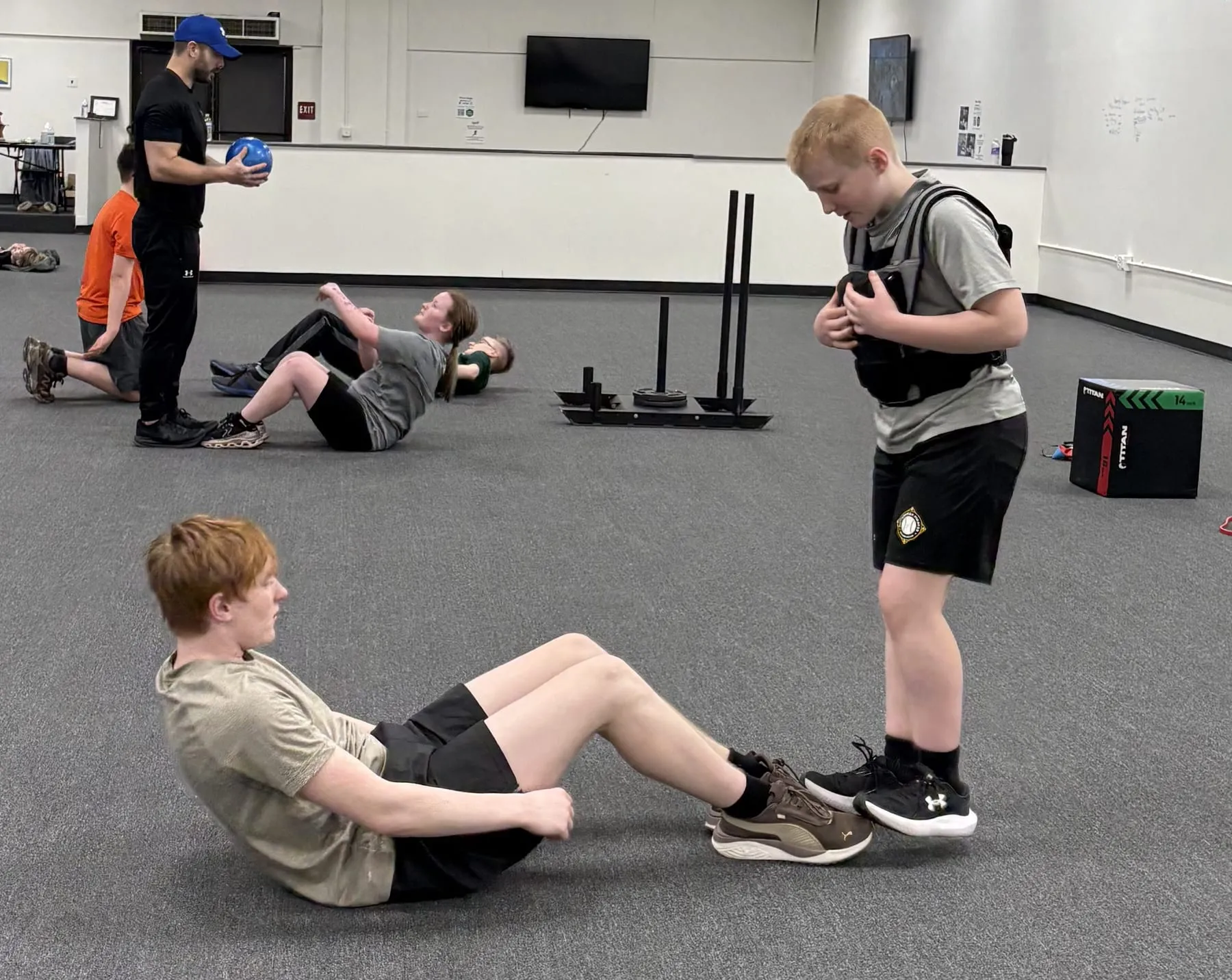 Athletes doing strength and core training with a coach at Velocity Sports Lab in Steubenville, Ohio